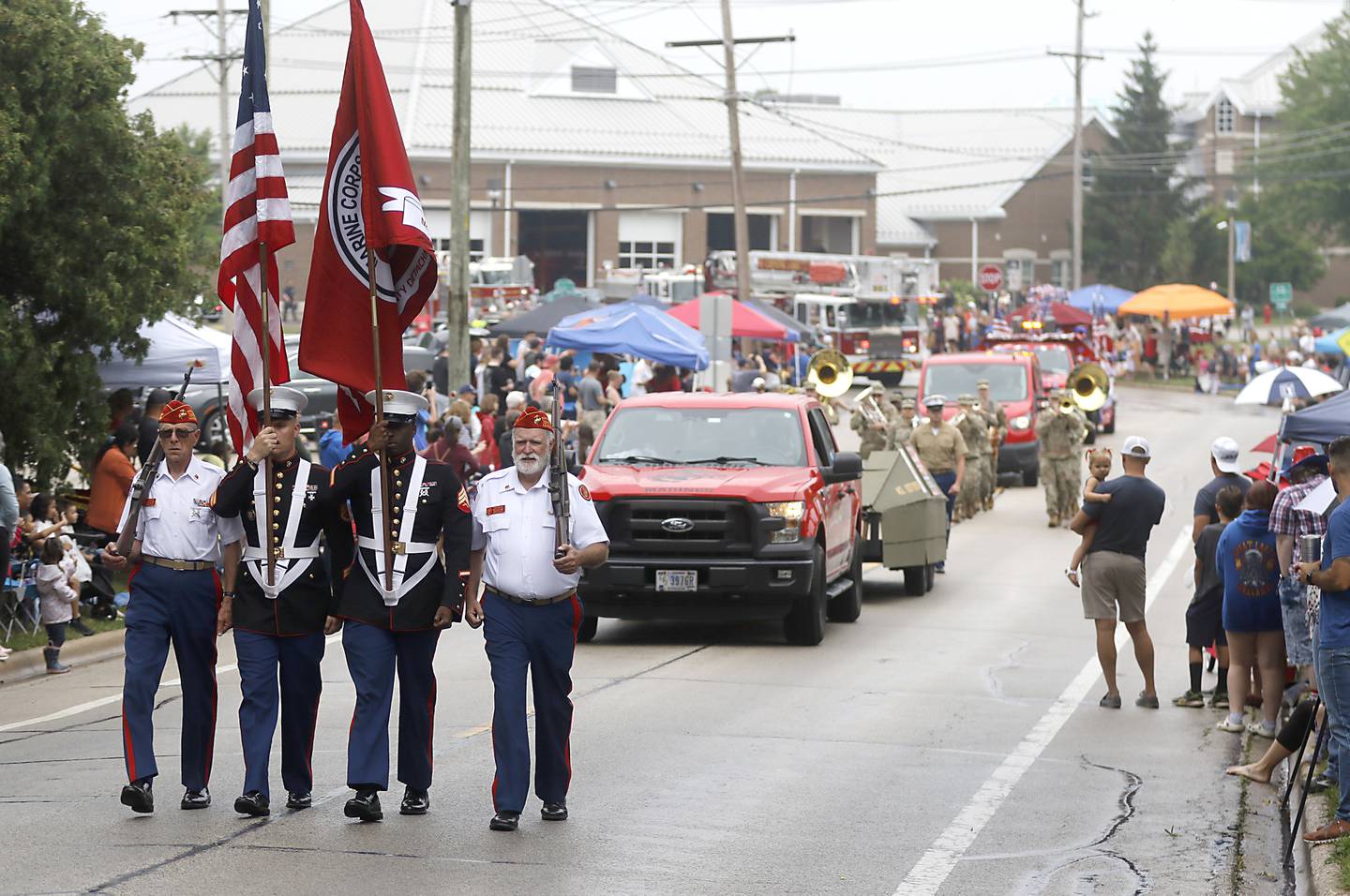 The U.S. Marine Corps Color Guard leads the parade Sunday, July 2, 2023 during Crystal Lake’s annual Independence Day Parade on Dole Avenue in Crystal Lake. This year’s parade feature close to 100 units.
