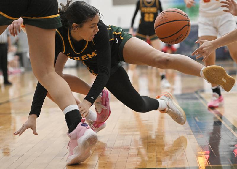 Fremd’s Coco Urlacher battles for the ball under the basket against Batavia in the Bartlett supersectional game on Monday, Feb. 26, 2024.