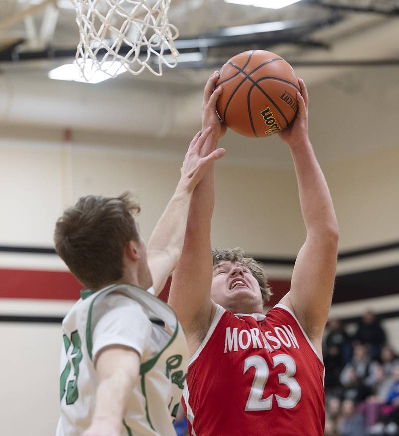 Morrison’s Carson Starting hauls in a rebound against Rock Falls’ Aydan Goff Wednesday, Feb. 21, 2024 at the Prophestown class 2A basketball regional.