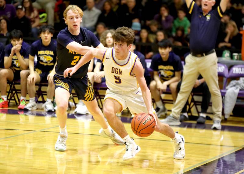 Downers Grove North’s Owen Thulin drives toward the basket away from Neuqua Valley’s Colin Gerrity during the Class 4A Downers Grove North Regional final on Friday, Feb. 23, 2024.