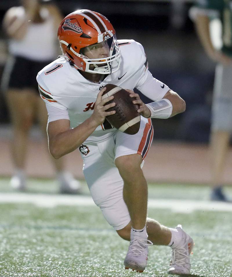 Hersey's Colton Gumino (1) looks for an open teammate  Friday September 1, 2023 in Palatine.