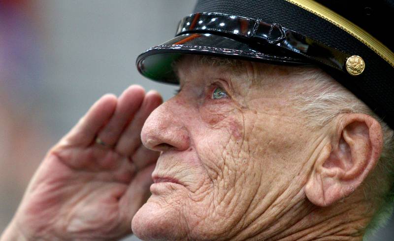 Army veteran Ben Jankowski of Woodstock salutes the flag  as McHenry Community High School hosted a celebration Sunday for veterans returning from an Honor Flight trip to Washington D.C. The Honor Flight trip was coordinated by the Veterans Network Committee of Northern Illinois.