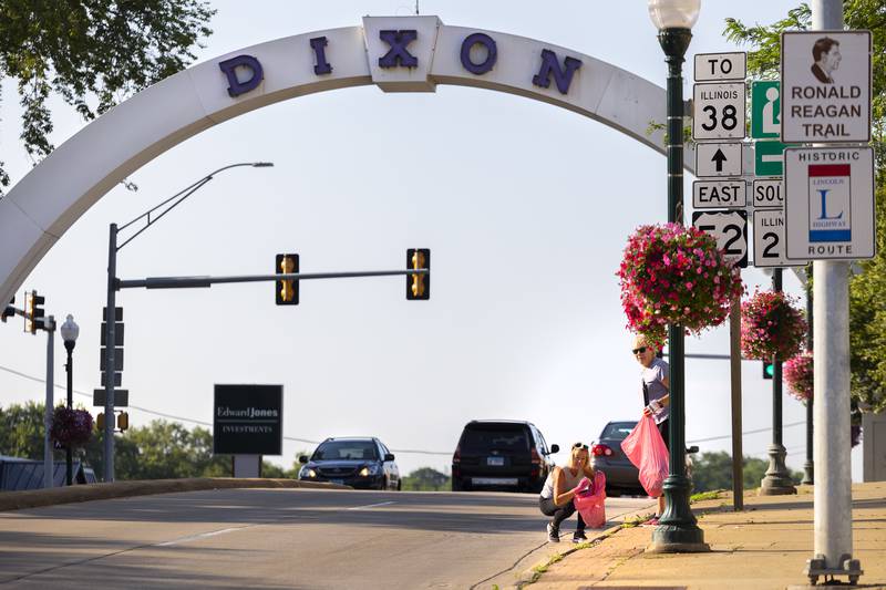 Sue Bennett (left) and Linda Loescher watch for traffic as they give Dixon a spit shine Thursday, July 6, 2023 during a monthly clean up day. Despite the thousands of people who visited Dixon for Petunia Fest, the volunteers commented how clean everything was and gave a thumbs up to the city and the Petunia Fest crew for their efforts.