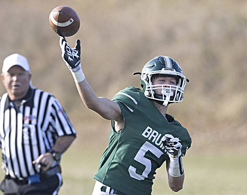 St. Bede's Callan Hueneburg throws a pass against Forreston during the Class 1A first round playoff game on Saturday, Oct. 29, 2022 at the Academy in Peru.