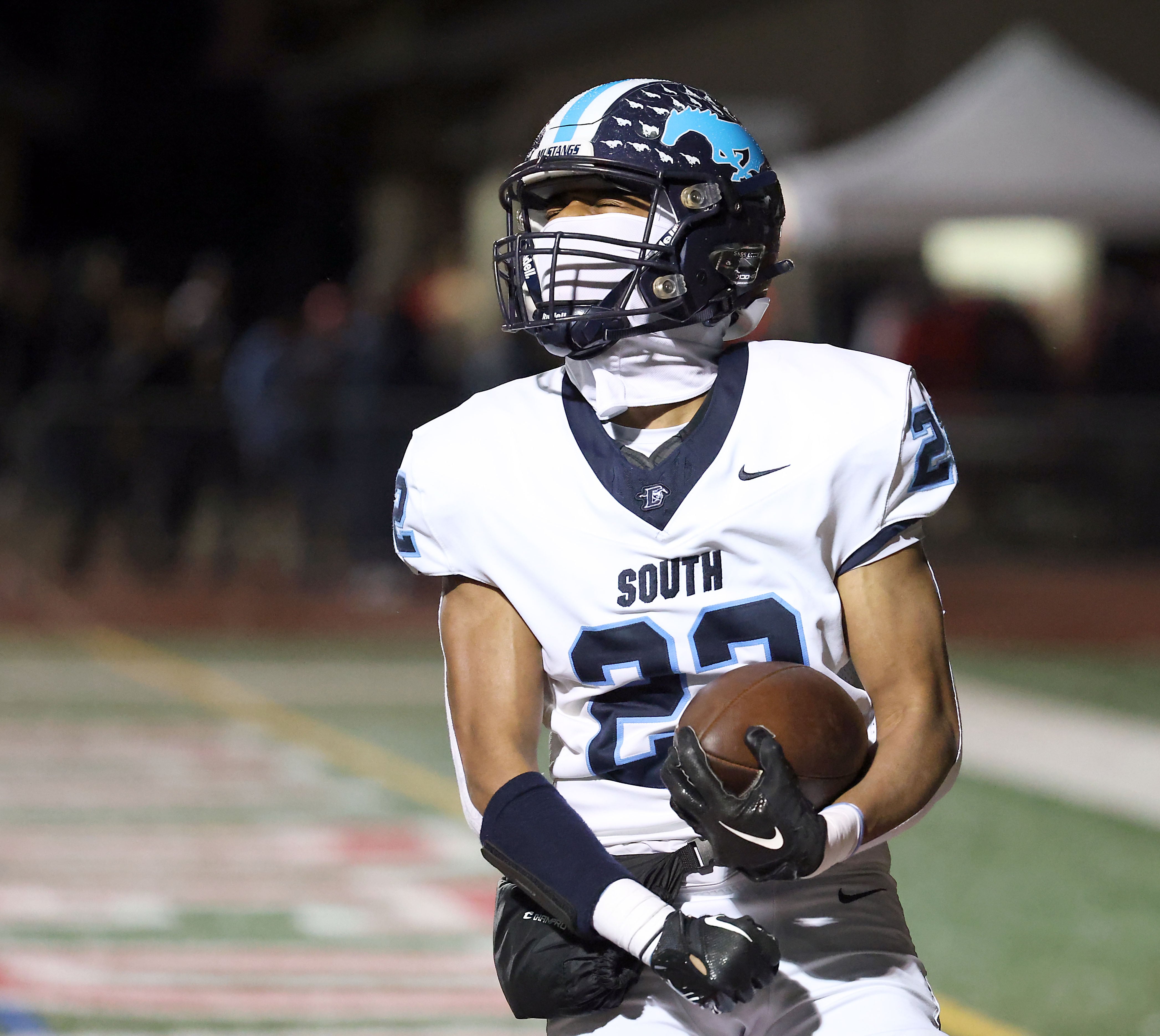 Downers Grove South's Keon Maggitt (22) celebrates a touchdown during a 2023 game in Naperville.