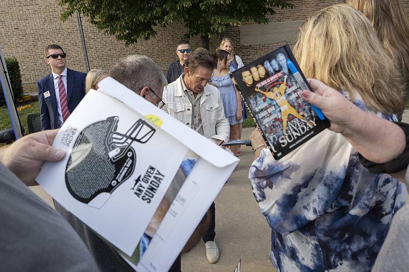 Actor Dennis Quaid stops to sign autographs Thursday, Aug. 22, 2024, before the premier showing of “Reagan.” Quaid was one of three actors portraying Ronald Reagan.