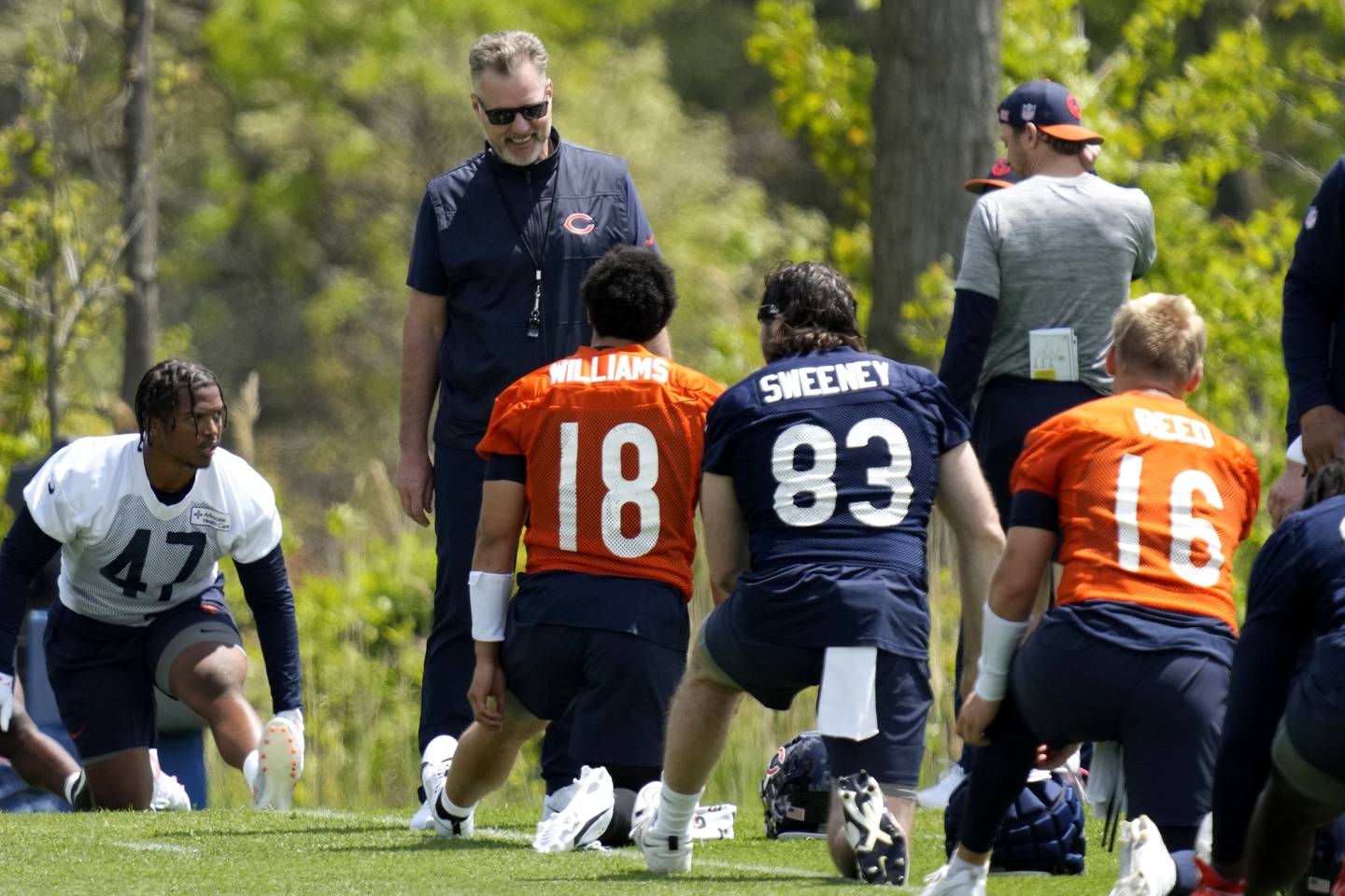 Chicago Bears head coach Matt Eberflus, left top, smiles as he talks with quarterback Caleb Williams (18) during the NFL football team's rookie camp in May at Halas Hall in Lake Forest, Ill.