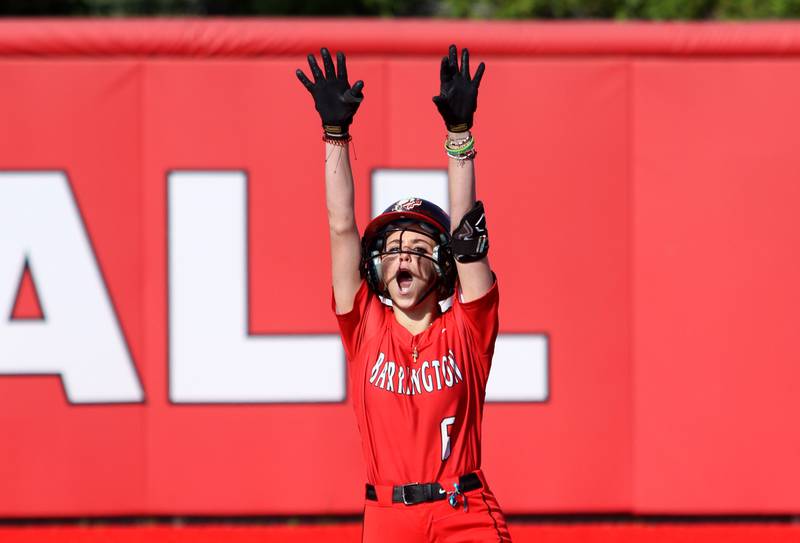 Barrington’s Gabi Phillis celebrates arriving at second base with an RBI double against Huntley in sectional final softball  action at Barrington Friday.