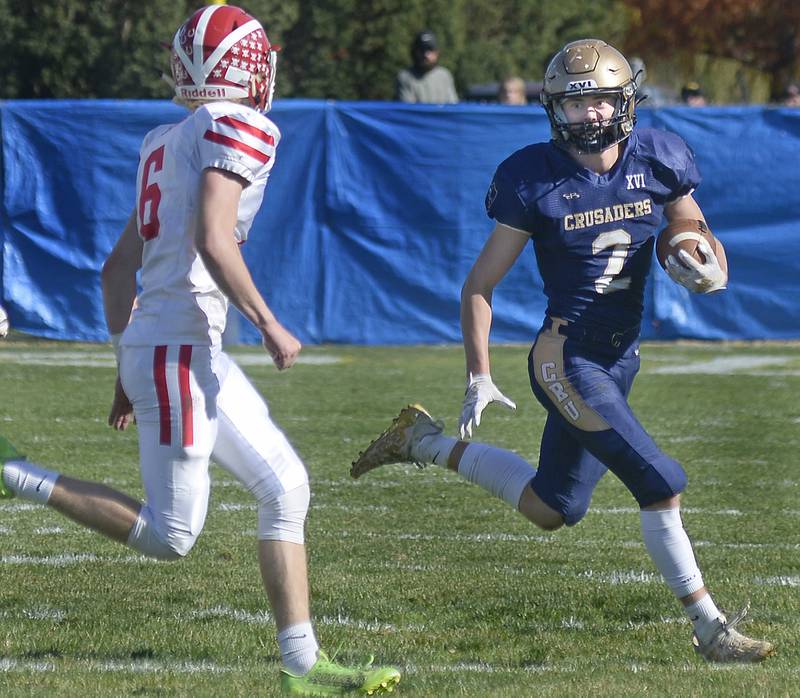 On a sweep, Marquette’s Logan Nelson works to get by Morrison’s Chase Newman on a run in the 1st quarter during the Class 1A first round playoff game on Saturday, Oct. 29, 2022 at Gould Stadium in Ottawa.