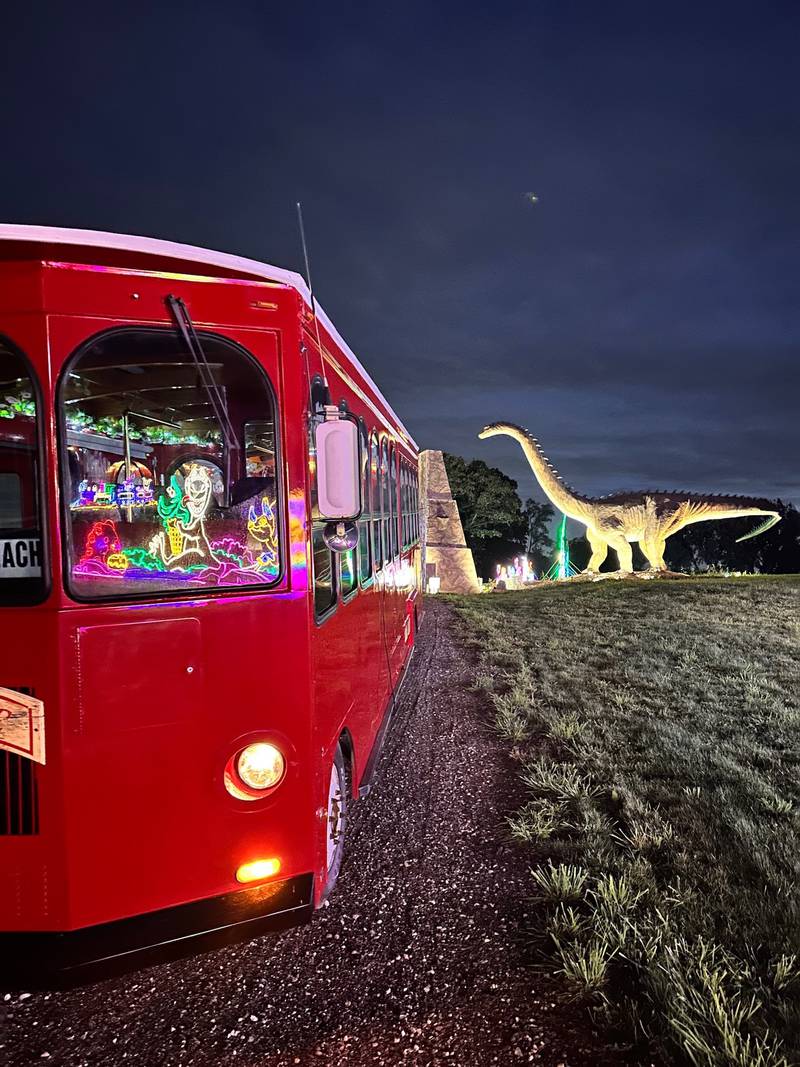 Light displays are reflected in the windows of one of Volo Museum's new Molly Trolleys during a tour set-up night on the museum grounds in Volo. Tickets are on sale now for upcoming Jolly Trolley Adventures.