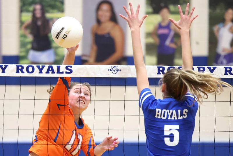 Genoa-Kingston's Lily Mueller spikes the ball past Rosary's Clare McEniry during their Regional semifinal match Tuesday, Oct. 25, 2022, at Rosary High School in Aurora