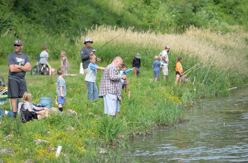 Kids and their parents and grandparents lined the banks of the Rock River on Saturday, June 15, 2024 for the 18th annual Dick Brown Fishing Derby at Prophetstown State Park.
