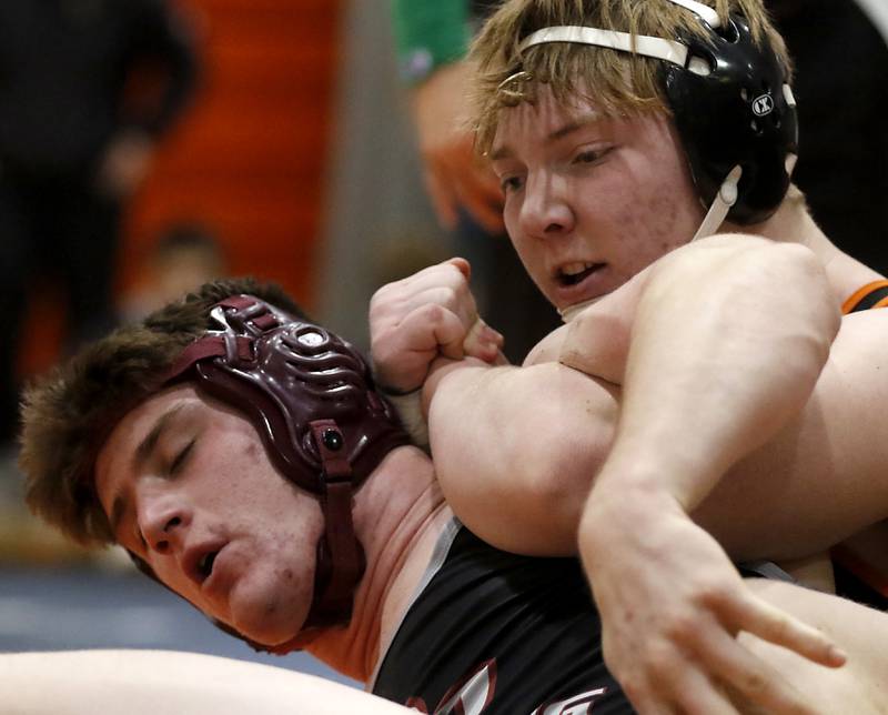 Crystal Lake Central Tommy McHeil tries to control Prairie Ridge\s John Fallaw during the 215-pound championship match of a the IHSA 2A Crystal Lake Central Wrestling Regional on Saturday, Feb. 3, 2024, at Crystal Lake Central High School.