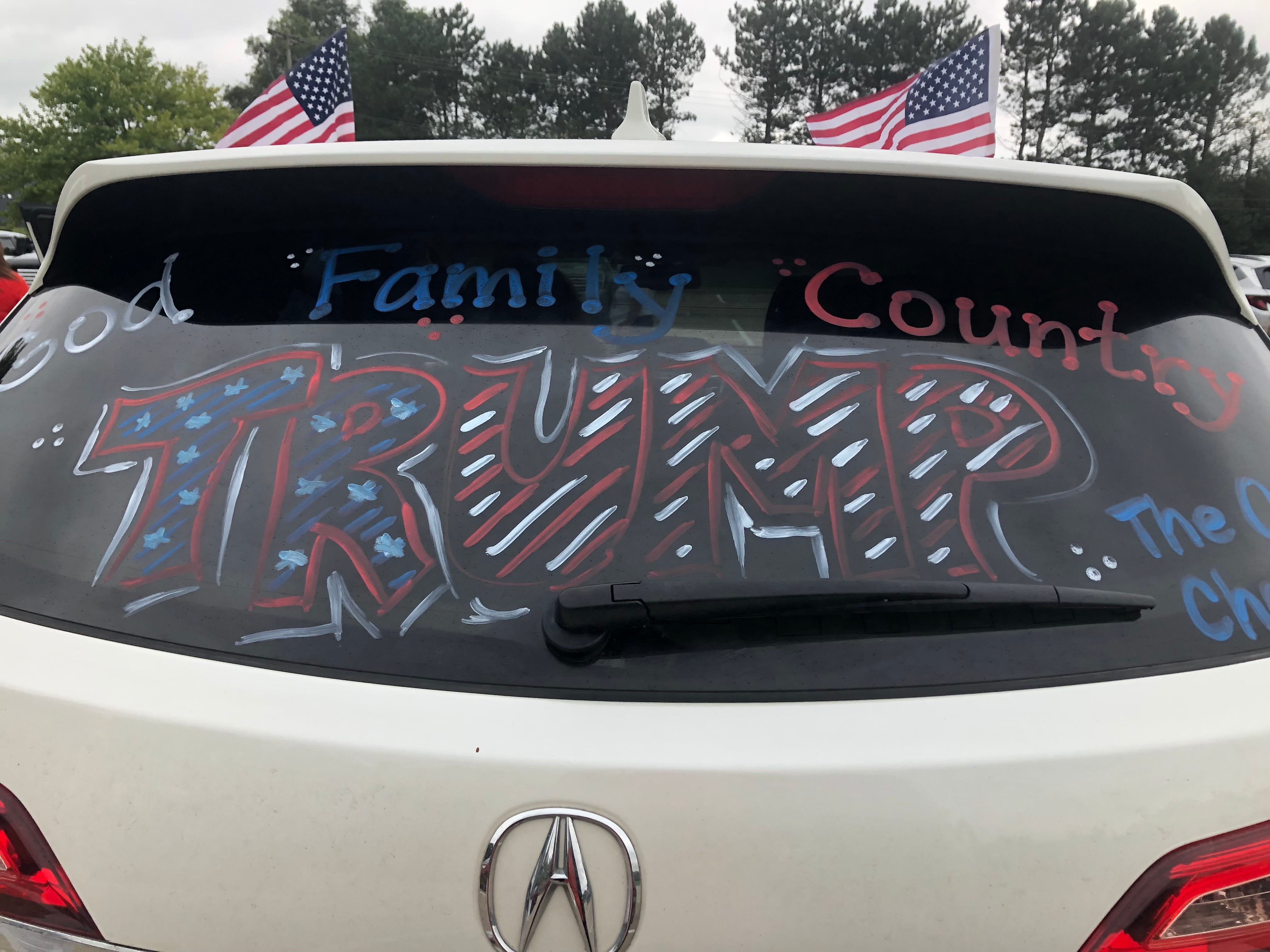 A car decorated with a pro-Trump messages gets ready to leave for the Woodstock rally from McHenry on a Aug. 18, 2024.