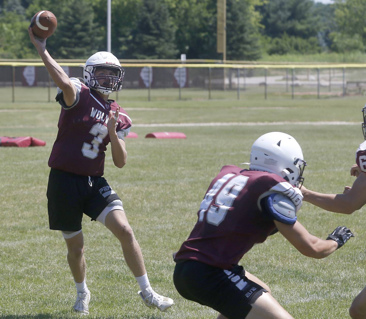 Prairie Ridge’s Tyler Vasey throws pass during summer football practice Tuesday, July 12 2022, at Prairie Ridge High School in Crystal Lake.