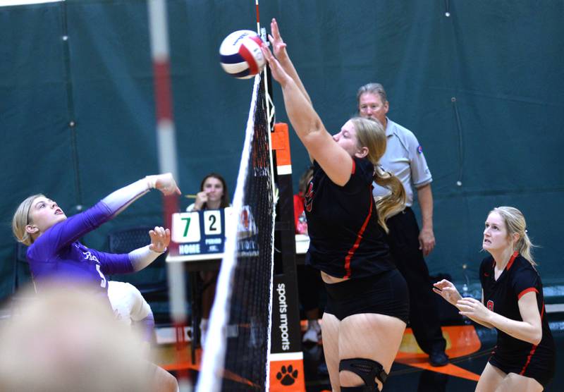 Fulton's Kylie Smither (20) blocks the ball against Rochelle during Saturday, Sept. 14, 2024 action at the Varsity Power Classic Tournament at Byron High School.