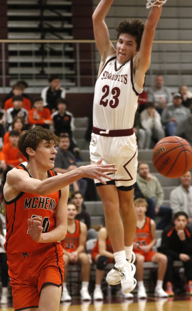 McHenry's Marcus Honea passes the ball as he is pressured by Antioch’s Carter Webb during a nonconference basketball game Thursday, Jan. 4. 2024, at Antioch High School.