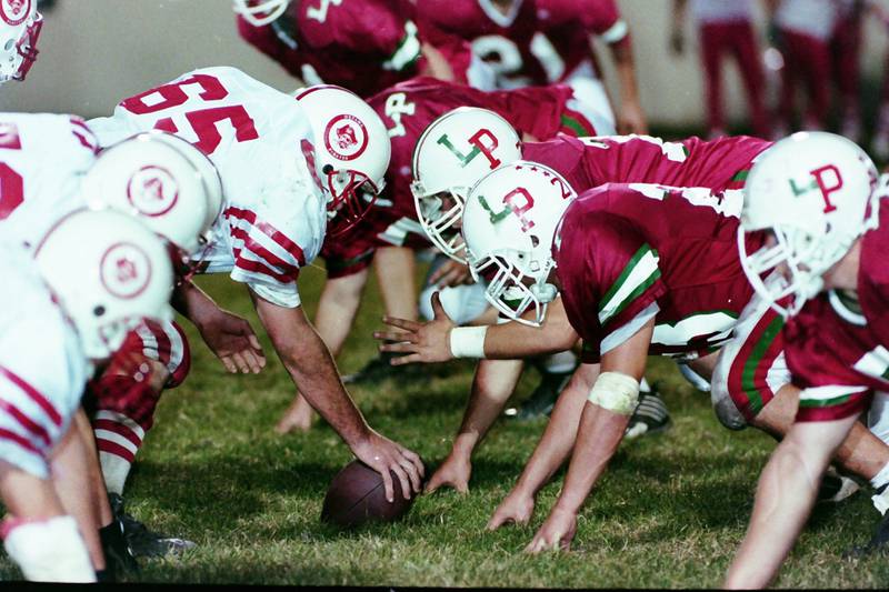 L-P and Ottawa play football in 1999. This was the 100th meeting between the two teams.