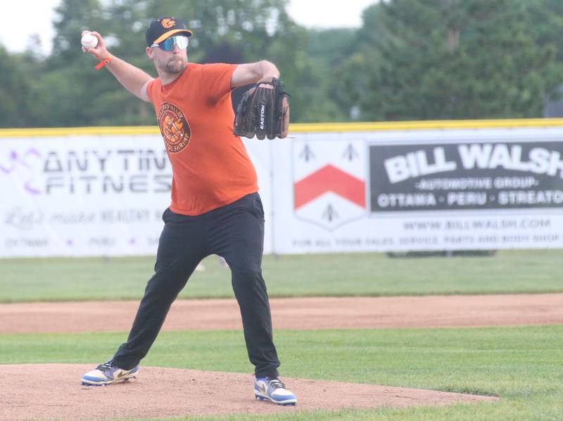 Scott Schweickert, son of Doug Schweickert, throws out the first pitch during emergency first responder night at the Illinois Valley Pistol Shrimp game in Schweickert Stadium on Tuesday, June 11, 2024 in Peru. The Schweickert family donated one-million in 2021 for a 575 box seat and grand stands at Veterans Park in Peru.