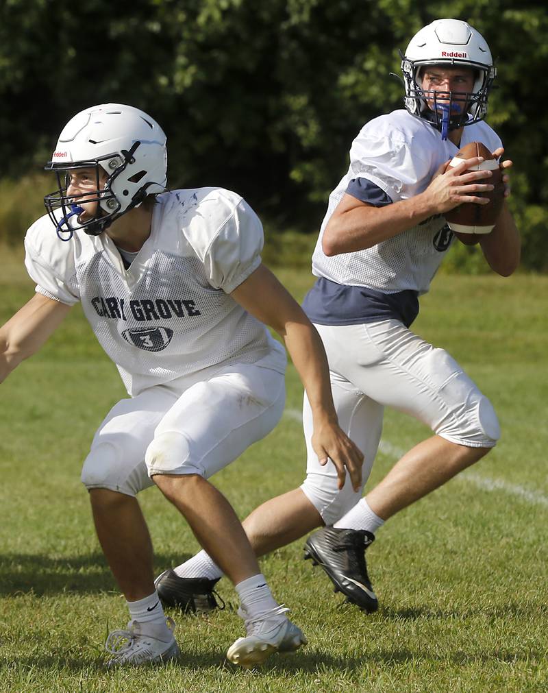 Quarterback Peyton Seaburg drops back to pass during football practice Tuesday, Aug. 20, 2024, at Cary-Grove High School, as the 2023 IHSA Class 6A champions look to defend their title.