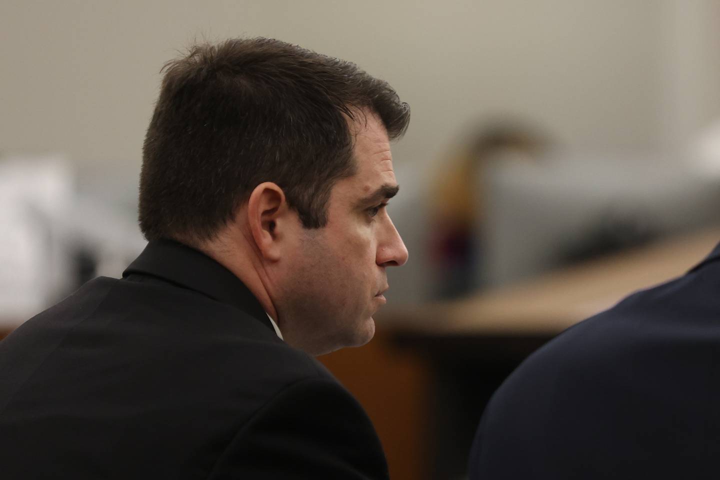 Prosecutor Jeffery Tuminello waits to make closing arguments on Monday in the case against Sean Woulfe at the Will County Courthouse. Sean Woulfe, 29, is charge with reckless homicide of Lindsey Schmidt, 29, and her three sons, Owen, 6, Weston, 4, and Kaleb, 1. Monday, Mar. 28, 2022, in Joliet.