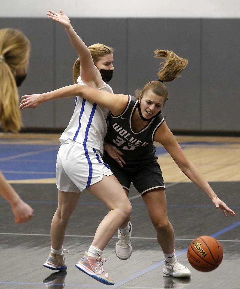 Prairie Ridge's Karsen Karlblom, right, tries to drive on Burlington Central's Rylie DuVal during Fox Valley Conference girls basketball game Monday evening, Jan. 31 2022, between Prairie Ridge and Burlington Central at Burlington Central High School.