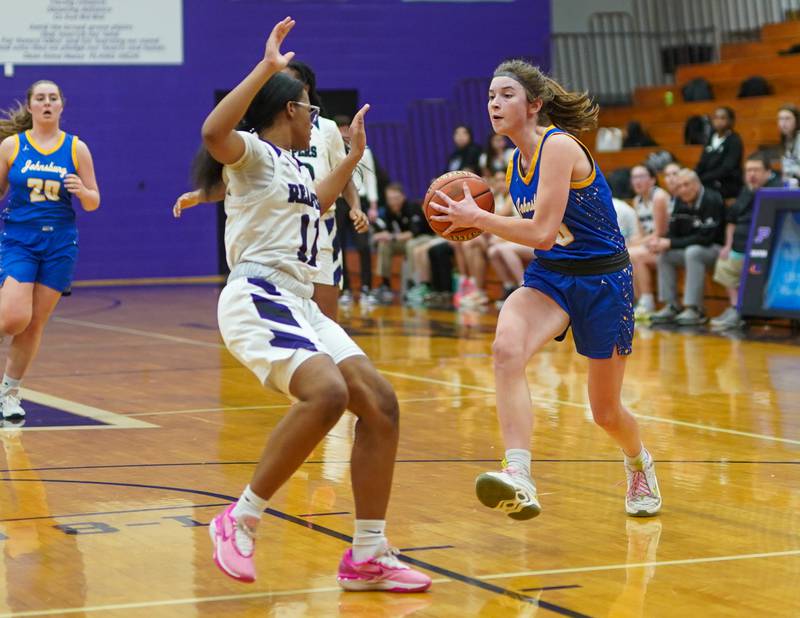 Johnsburg's Wynne Oeffling (10) drives to the hoop against Plano's Jadyn Long (11) during a basketball game at Plano High School on Tuesday, Jan 30, 2024.