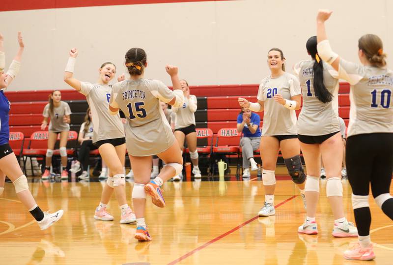 Members of the Princeton volleyball team celebrate their victory after defeating Hall on Tuesday, Sept. 17, 2024 at Hall High School.