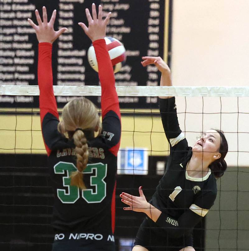 Sycamore's Grace Lichardt tries to spike it by LaSalle-Peru's Kelsey Frederick during their match Tuesday, Oct. 10, 2023, at Sycamore High School.