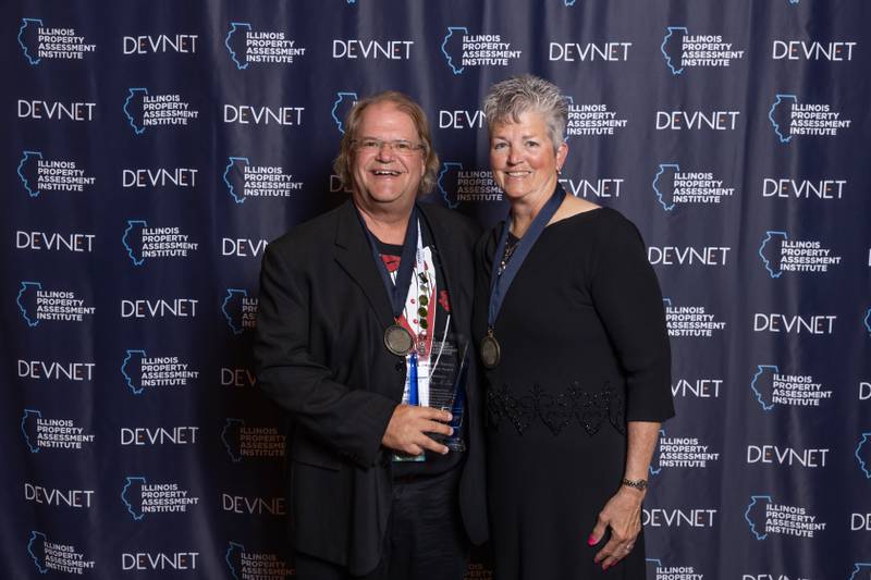 Jeff Lee (left), 2024 Marshall Theroux Award winner & Lake Villa Township Assessor; Deb Lane, 2023 Theroux Award recipient and 2024 presenter.