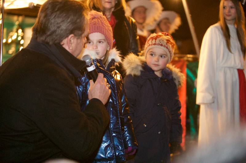 Mayor Kevin Burns with Freya and Liam Egan age 6 from Geneva light the tree at the Geneva Christmas Walk on Friday, Dec.1 2023 in Geneva.