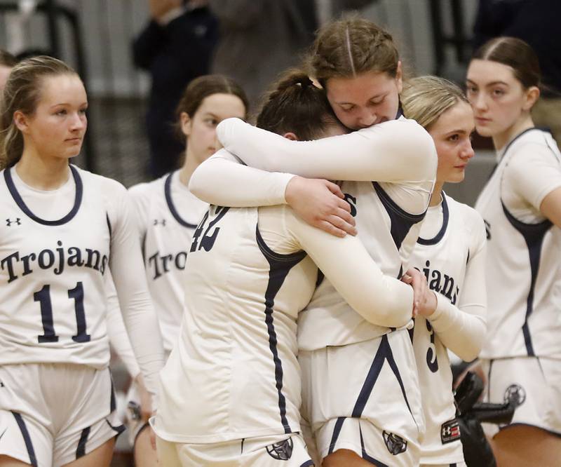 Cary-Grove's Ellie Mjaanes (right) hugs her teammate, Emily Larry, after Cary-Grove lost to St. Viator in a IHSA Class 3A Antioch Sectional semifinal girls basketball game on Tuesday, Feb. 20, 2024, at Antioch High School.