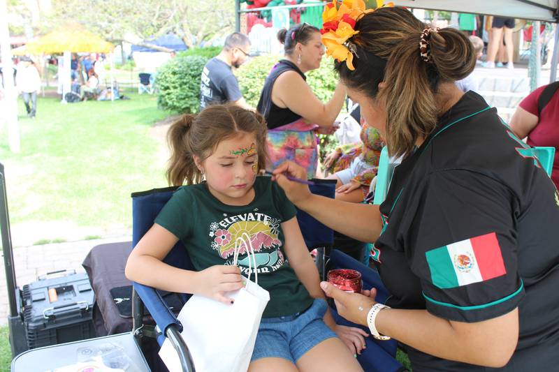 Remy of Woodstock gets her face painted at the Woodstock Mexican Independence Day celebration.