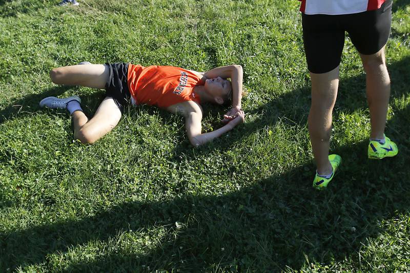 McHenry Miles Wagner recovers after finishing the boys race of the McHenry County Cross Country Invite on Saturday, August 31, 2024, at McHenry Township Park in Johnsburg.