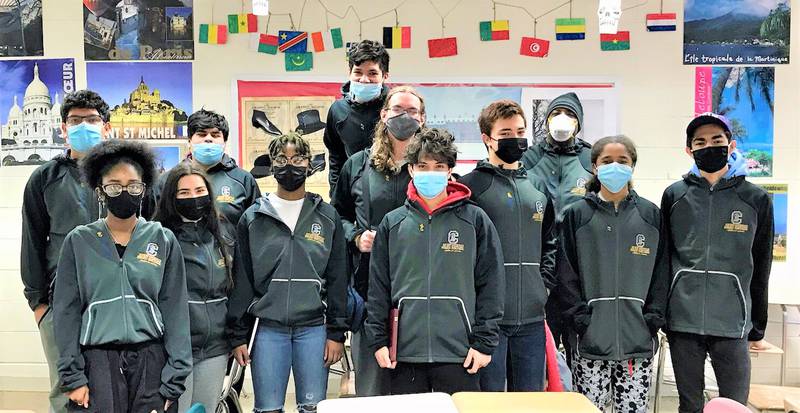 Pictured are members of the Joliet Central Chess team in January 2022, from left: Jose Mendeita, Kevin Martinez, Cris Cruz, Matthew Budde, Sergio Zavala, Coach Rodney Coatney, Elijah Rodriguez and Carlos Manzo; and front row, from left: Mya Ballard, Diana Sanchez, Tamia Vaughn and Gio Cruz.