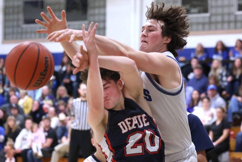 Hinckley-Big Rock's Martin Ledbetter and DePue’s Vance Hayes go after a rebound during their game Tuesday, Feb. 13, 2024, at Hinckley-Big Rock High School.