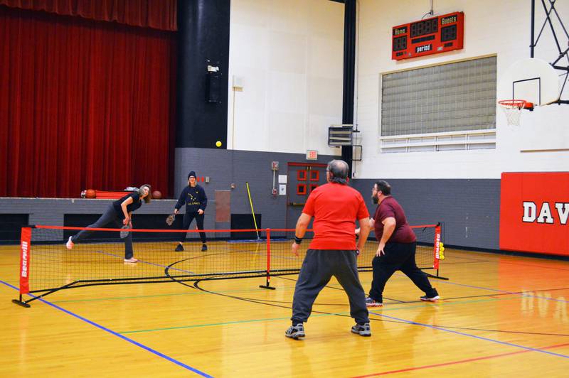 Kim Carlson, of Leaf River, back left, and Michelle Brandemuehl, of Mount Morris, face off against Bob Hachmeister, of Leaf River, front left, and Randall Westfall, of Oregon, in a game of pickleball in the former David L. Rahn Junior High School on Thursday, Feb. 15, 2024.