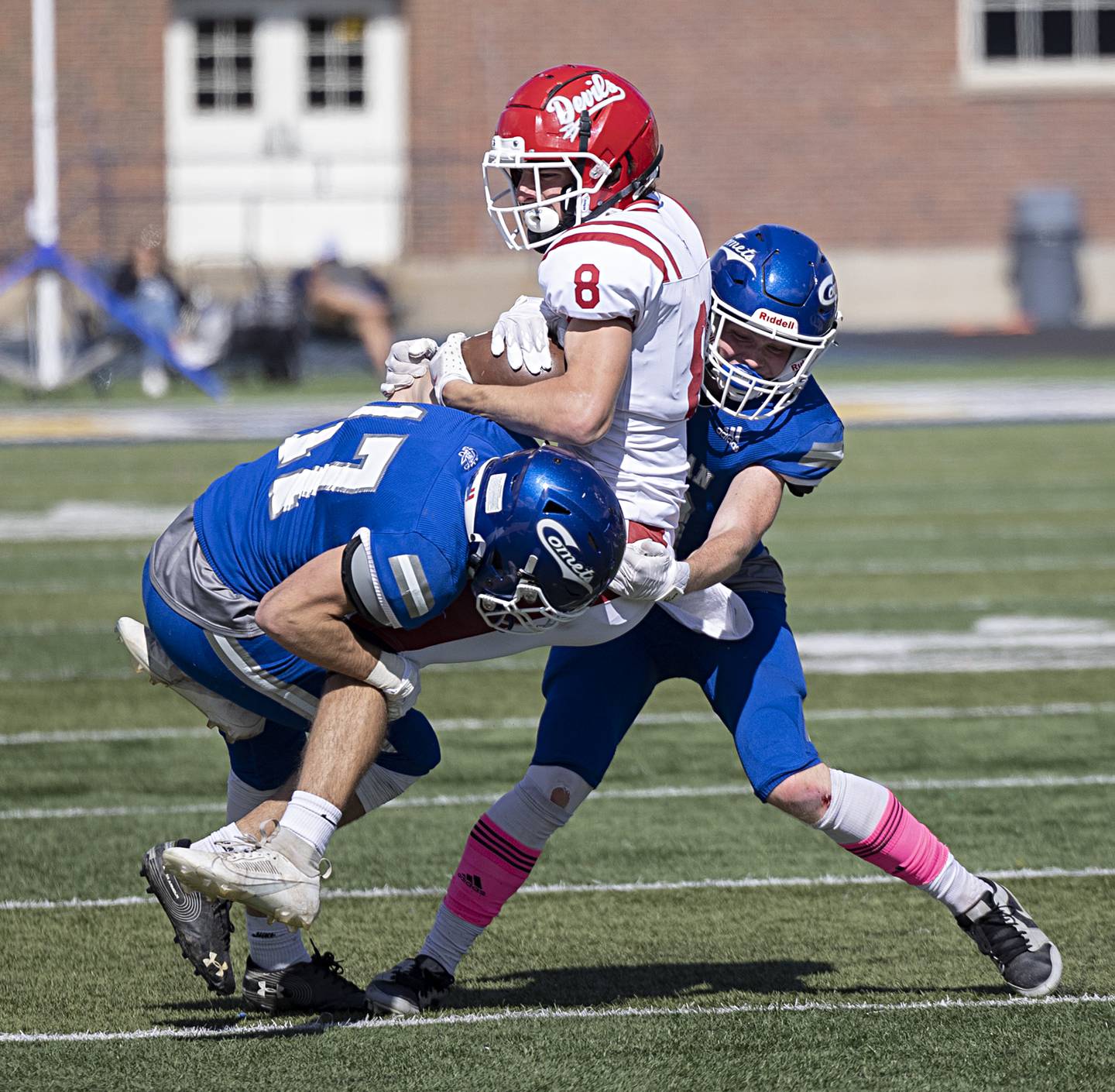 Hall’s Braden Curran is tackled by Newman’s Carter Rude and Mac Hanrahan Saturday, Oct. 7, 2023 in a game in Sterling.