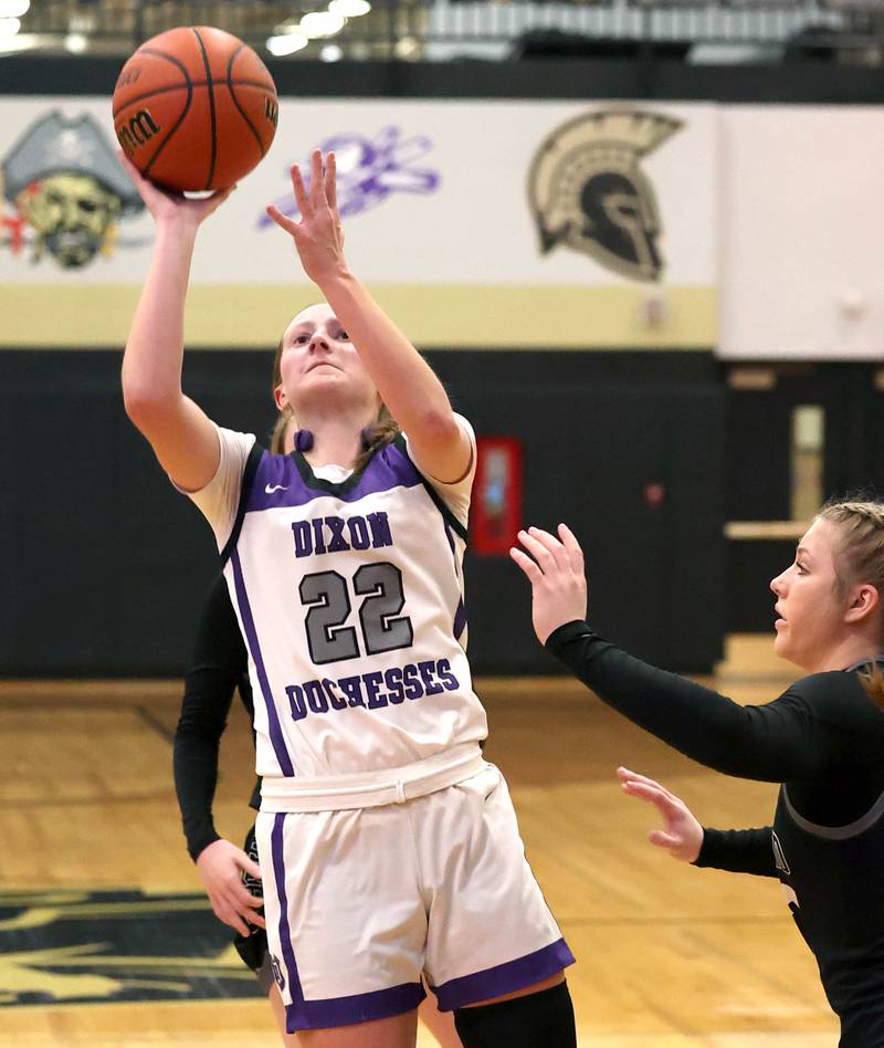 Dixon’s Katie Drew gets up a shot in front of Kaneland's Kendra Brown Thursday, Feb. 22, 2024, during their Class 3A sectional final game at Sycamore High School.