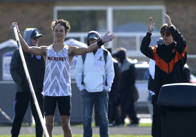 McHenry’s Zachary Galvicius tries to fire up the crowd as he tries to clear 15 feet 8 inches during the pole vaults Friday, April 21, 2023, at the McHenry County Track and Field Meet at Cary-Grove High School.