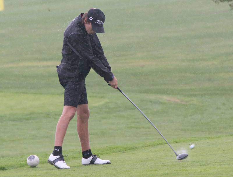 Henry-Senachwine's Carson Rowe tees off in the pouring rain during the Class 1A Regional on Wednesday, Sept. 27, 2023 at Wolf Creek Golf Club in Pontiac.