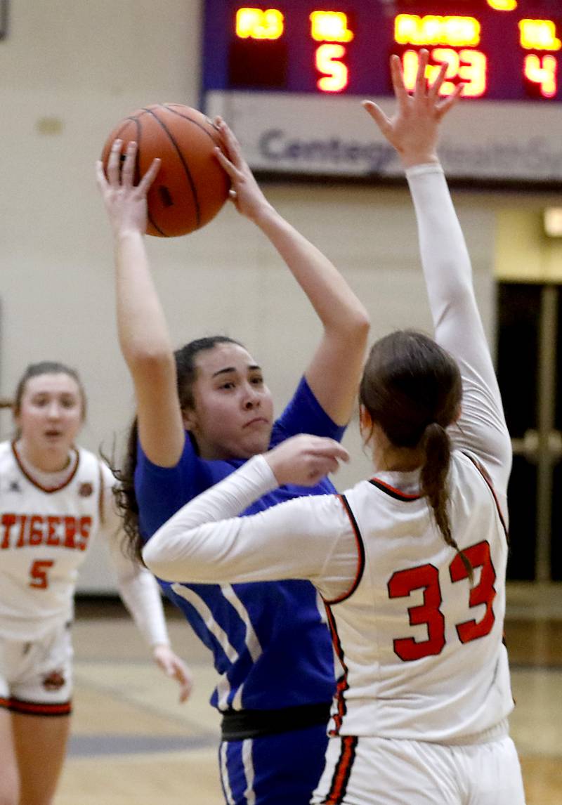 Burlington Central's Mia Hansen tries to drive to the basket against Crystal Lake Central's Katie Hamill during the IHSA Class 3A Woodstock Regional Championship girls basketball game on Thursday, Feb. 15, 2024, at Woodstock High School.