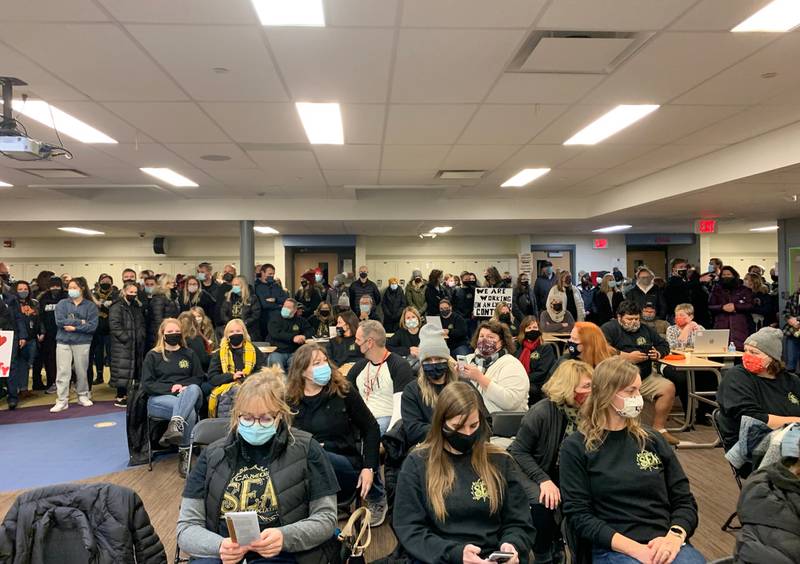 More than 300 people attended a candlelight vigil on Tuesday, Dec. 14, 2021, outside Sycamore Middle School because the Sycamore Education Association and Sycamore School District 427 have still not yet agreed upon a contract. The contract expired July 31.