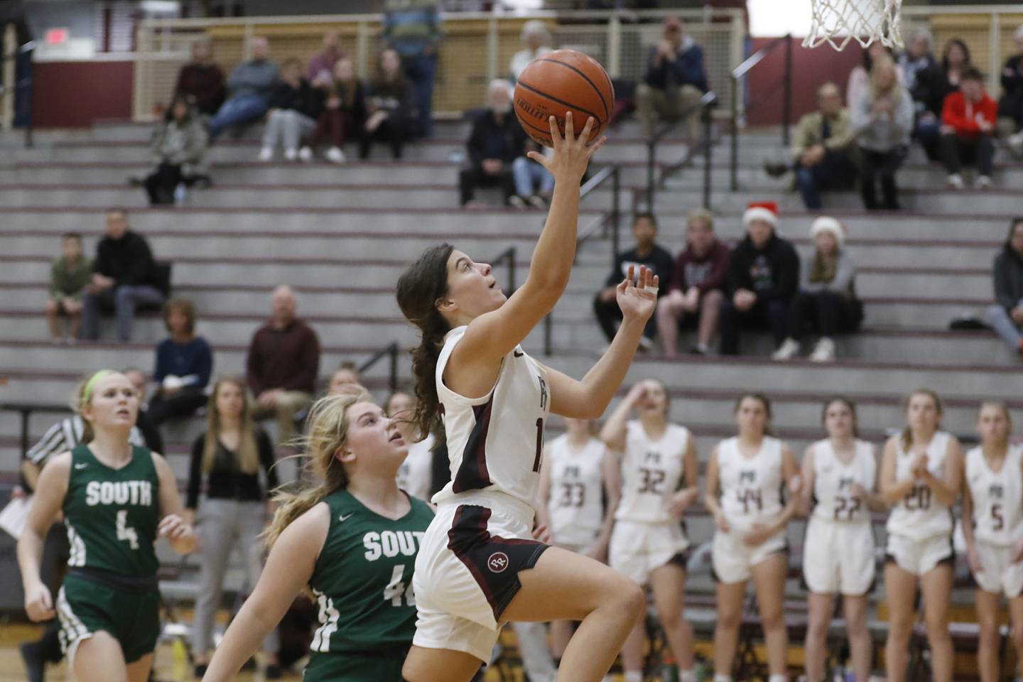 Prairie Ridge's Grace Koeppen, right, drives to the basket against Crystal Lake South's Laken LePage during a Fox Valley Conference girls basketball game Tuesday, Dec. 6, 2022, between Prairie Ridge and Crystal Lake South at Prairie Ridge High School.