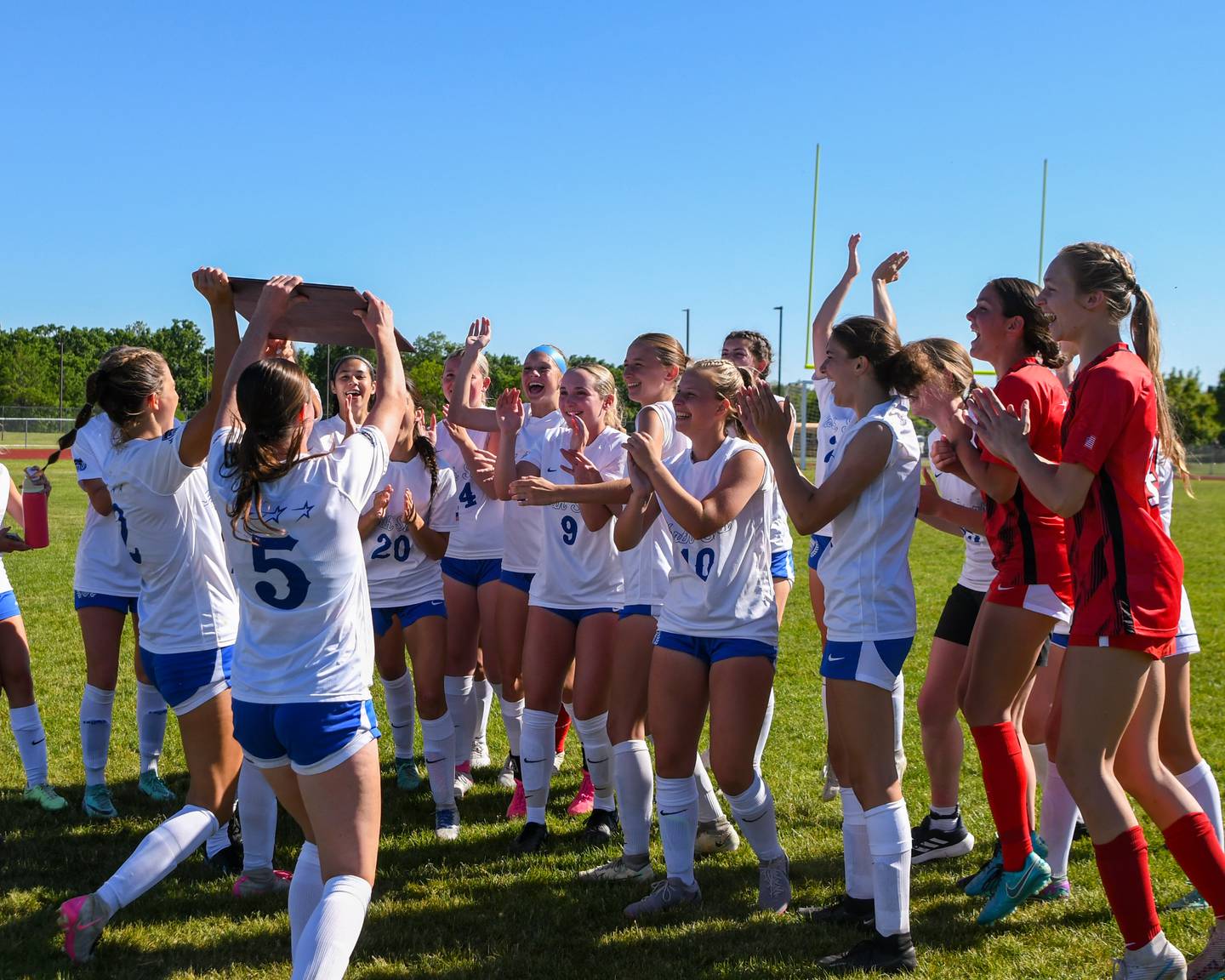 St. Charles North celebrates after winning the sectional championship game over Wheaton North on Saturday May 25, 2024, held at South Elgin High School.