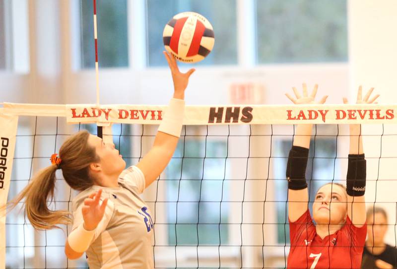 Princeton's Ellie Harp pushes the ball oer the net to Hall's Morgan Hoscheid on Tuesday, Sept. 17, 2024 at Hall High School.