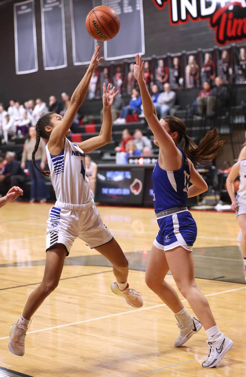 Newark’s Kiara Wesseh shoots over Hinckley-Big Rock's Raven Wagner Thursday, Jan. 18, 2024, during the Little 10 girls basketball tournament at Indian Creek High School in Shabbona.