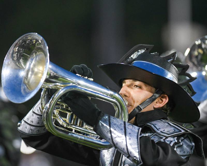 A member of The Cavaliers from Rosemont, Illinois, plays a French horn during the Drum Corps International Midwest Classic on Saturday, July 13, 2024, at Northern Illinois University Huskie Stadium in DeKalb.