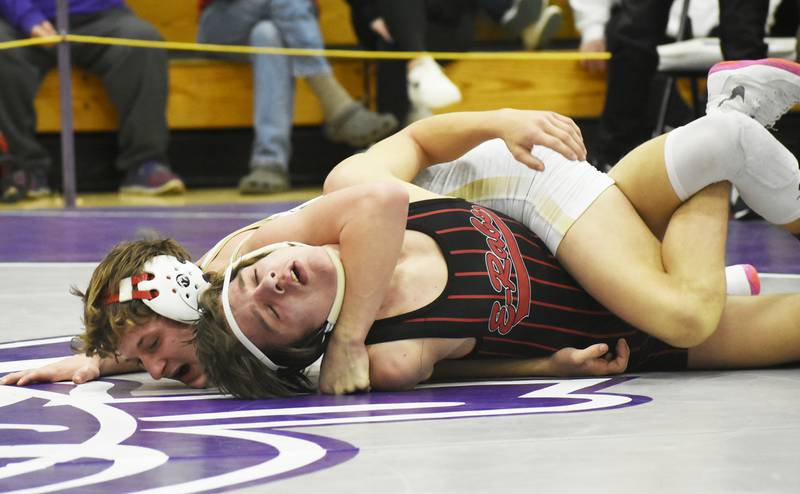 Sycamore’s Tyler Lockhart controls Rockford East’s Joseph Young during the IHSA Class 2A Rochelle Wrestling Regional on Saturday, Feb. 4, 2024.