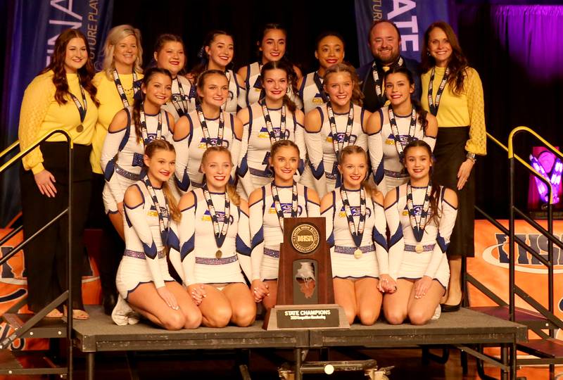 Members of the Johnsburg cheer pose with their first place trophy during the IHSA Cheer State Finals in Grossinger Motors Arena on Saturday, Feb. 4, 2023 in Bloomington.